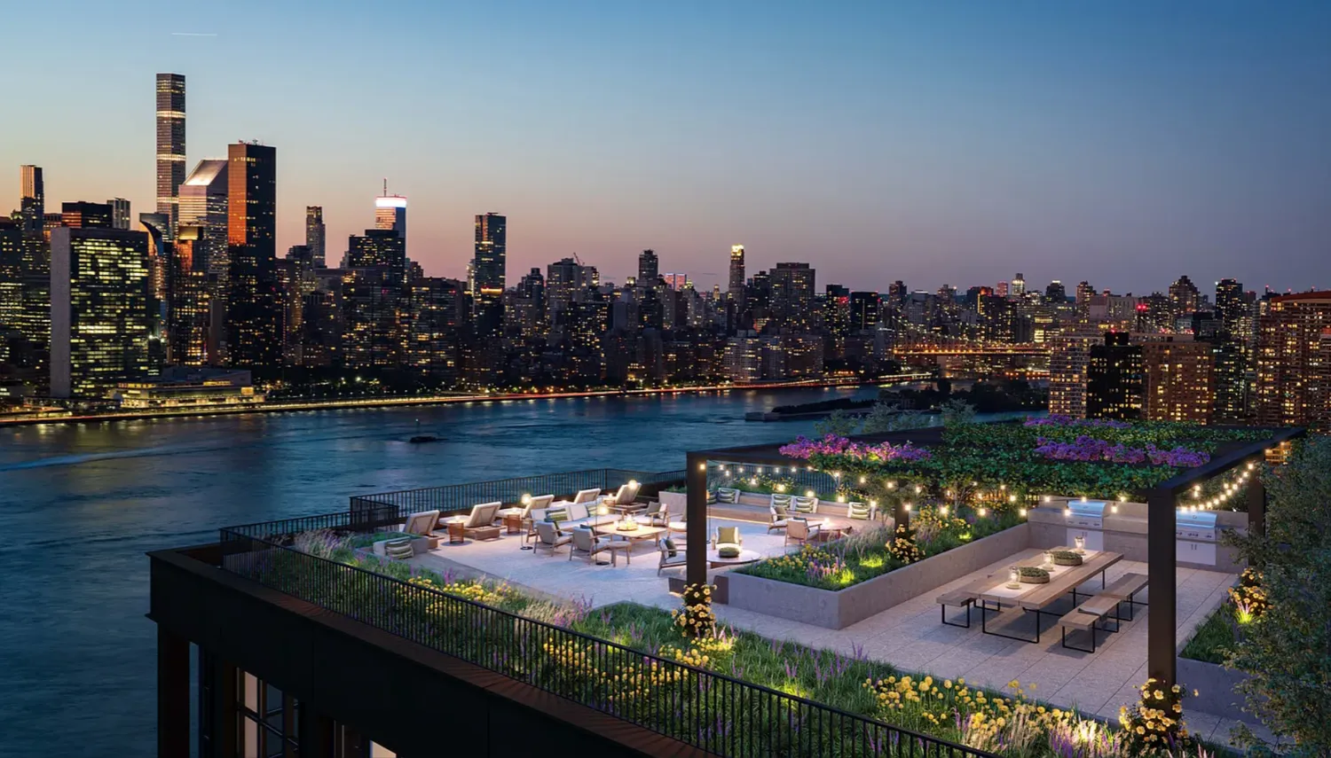 a view of a city with water and tall buildings