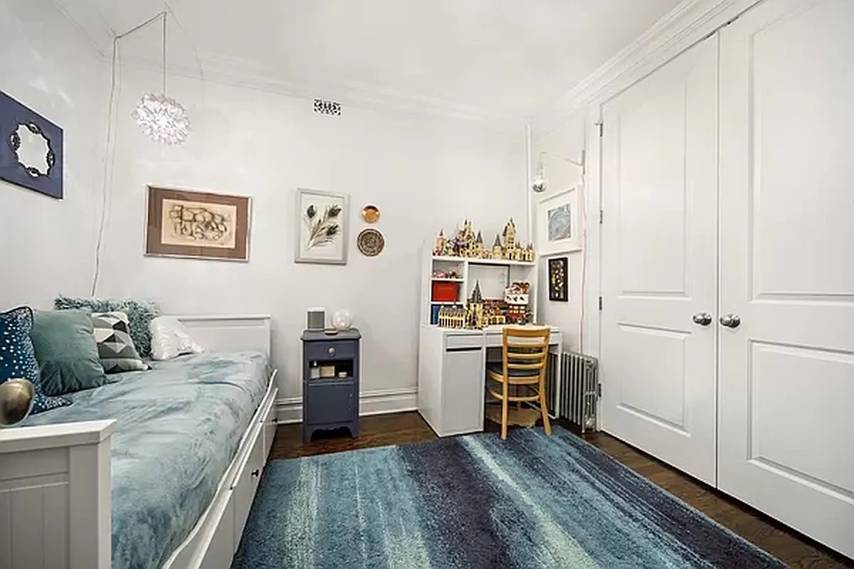 320 7th Avenue, Unit 1 Brooklyn, NY 11215 - Photo 3 of 7 a bedroom with a bed and a window