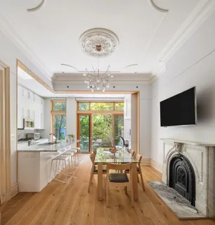 a view of a dining room with furniture window and outside view