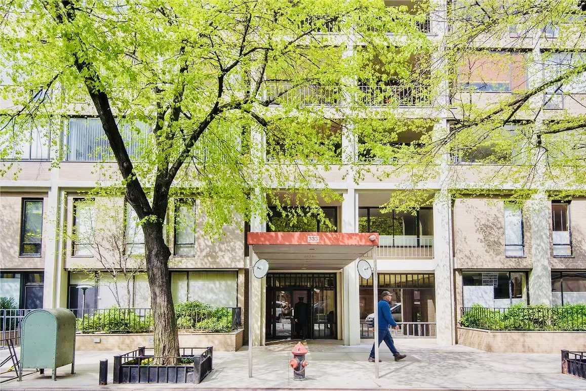 333 East 69th Street, Unit 10J Manhattan, NY 10021 - Photo 10 of 12 a view of a building with a tree
