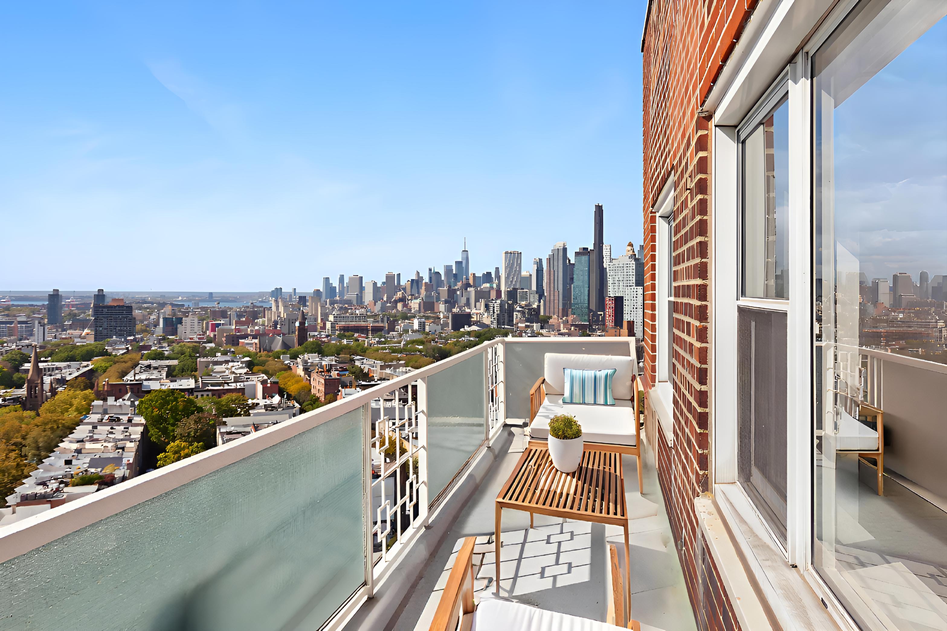 a view of a balcony with city view