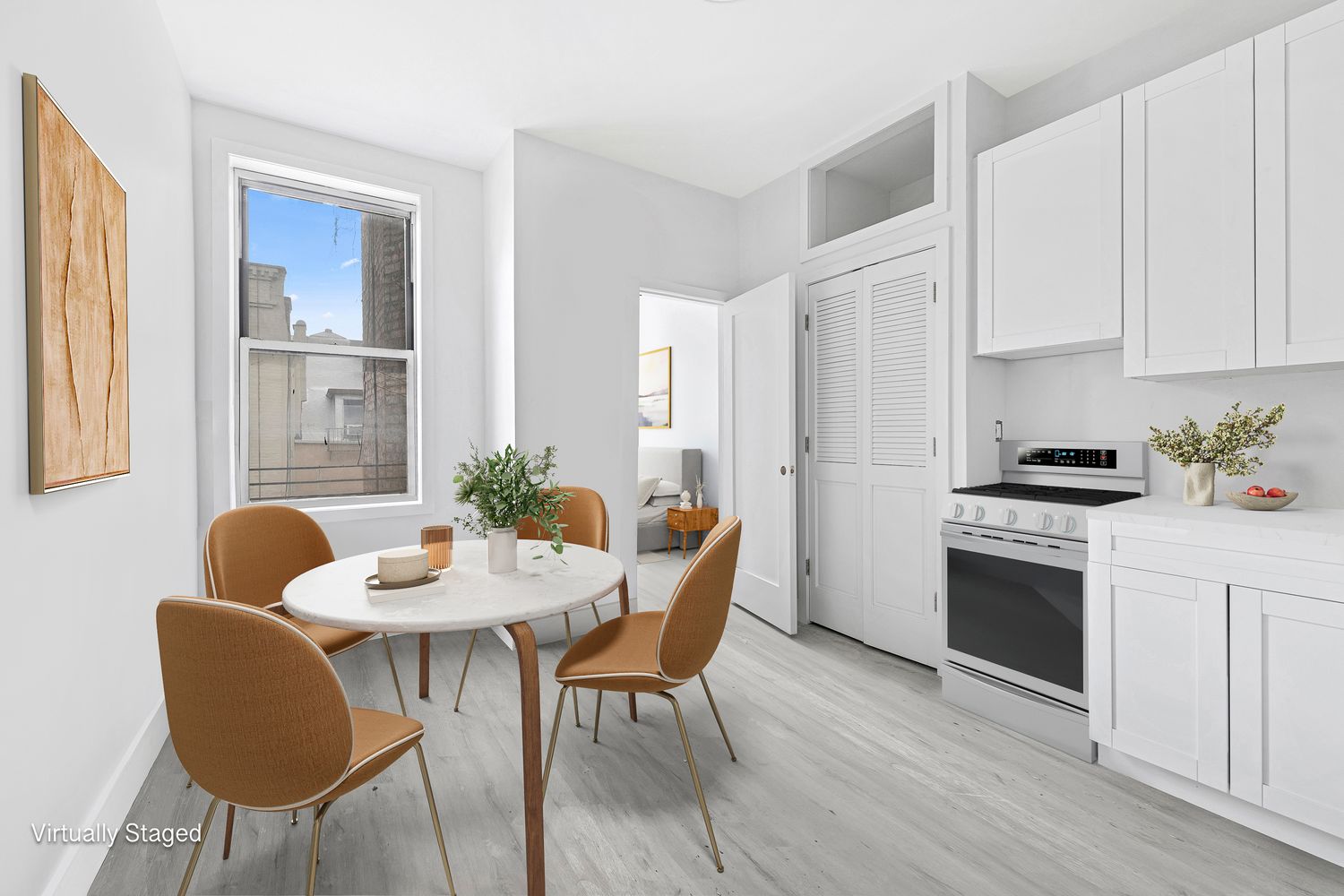 25 East 7th Street, Unit 9 Manhattan, NY 10003 - Photo 2 of 5 a dining room with furniture and wooden floor