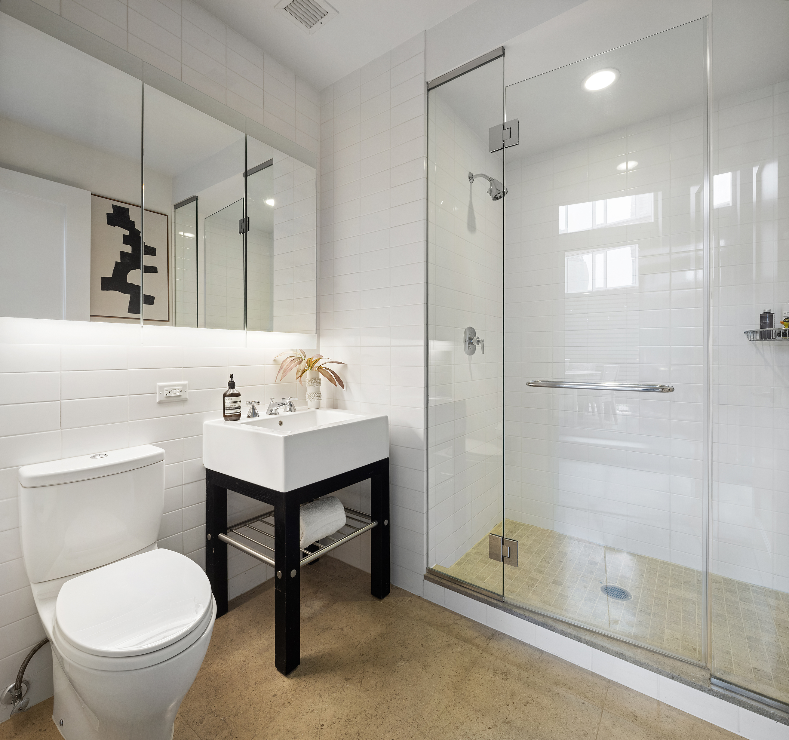 70 Little West Street, Unit 7L Manhattan, NY 10004 - Photo 23 of 25 a bathroom with a sink toilet and shower