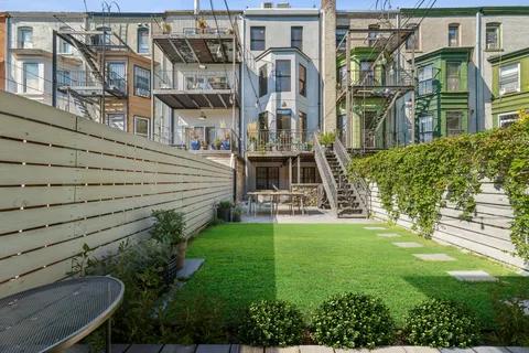 a view of backyard with sitting area