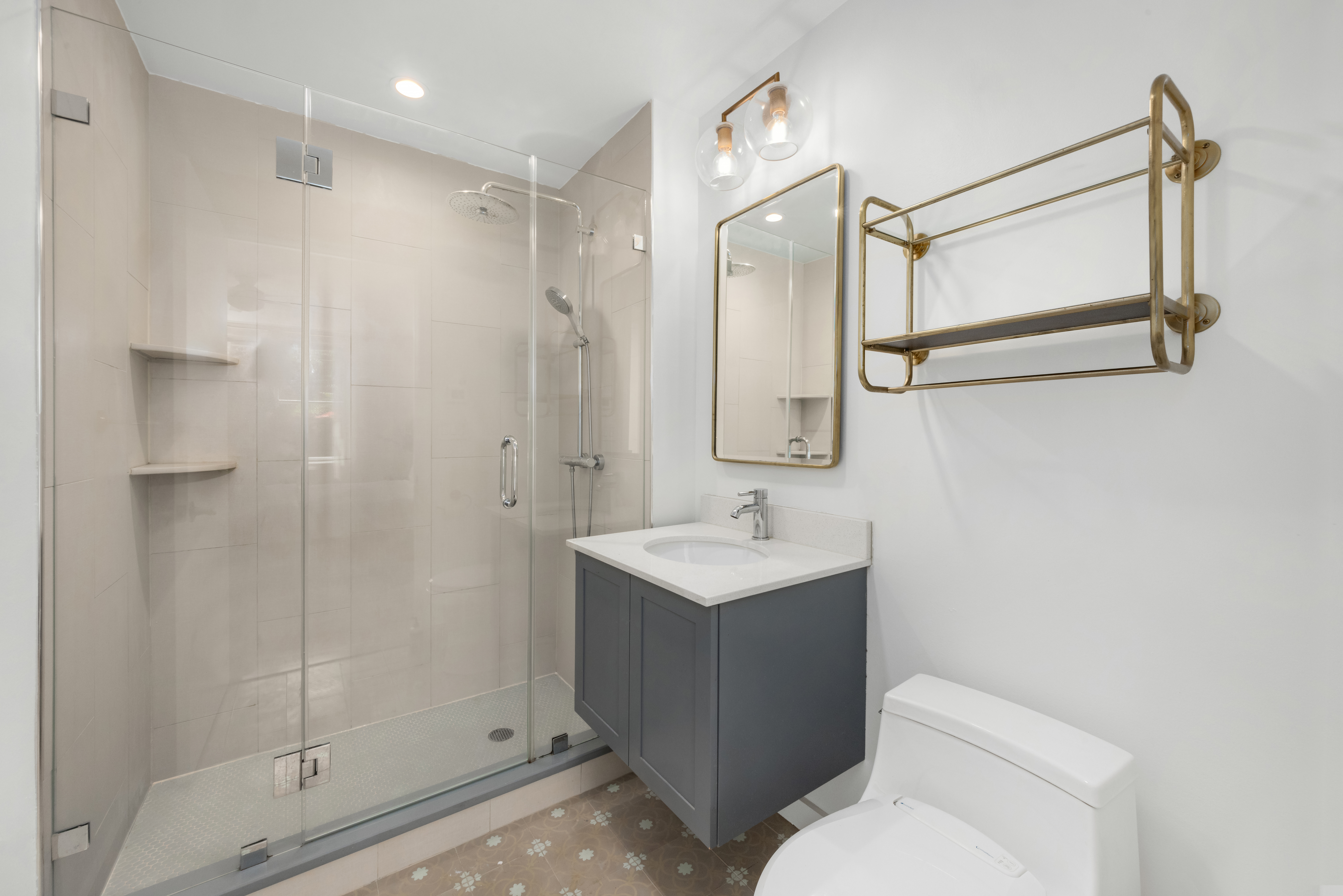 150 South 1st Street, Unit 2K Brooklyn, NY 11211 - Photo 8 of 12 a bathroom with a toilet a sink and shower