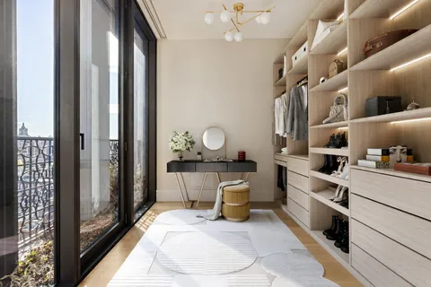 a very nice looking room with a large window and chandelier