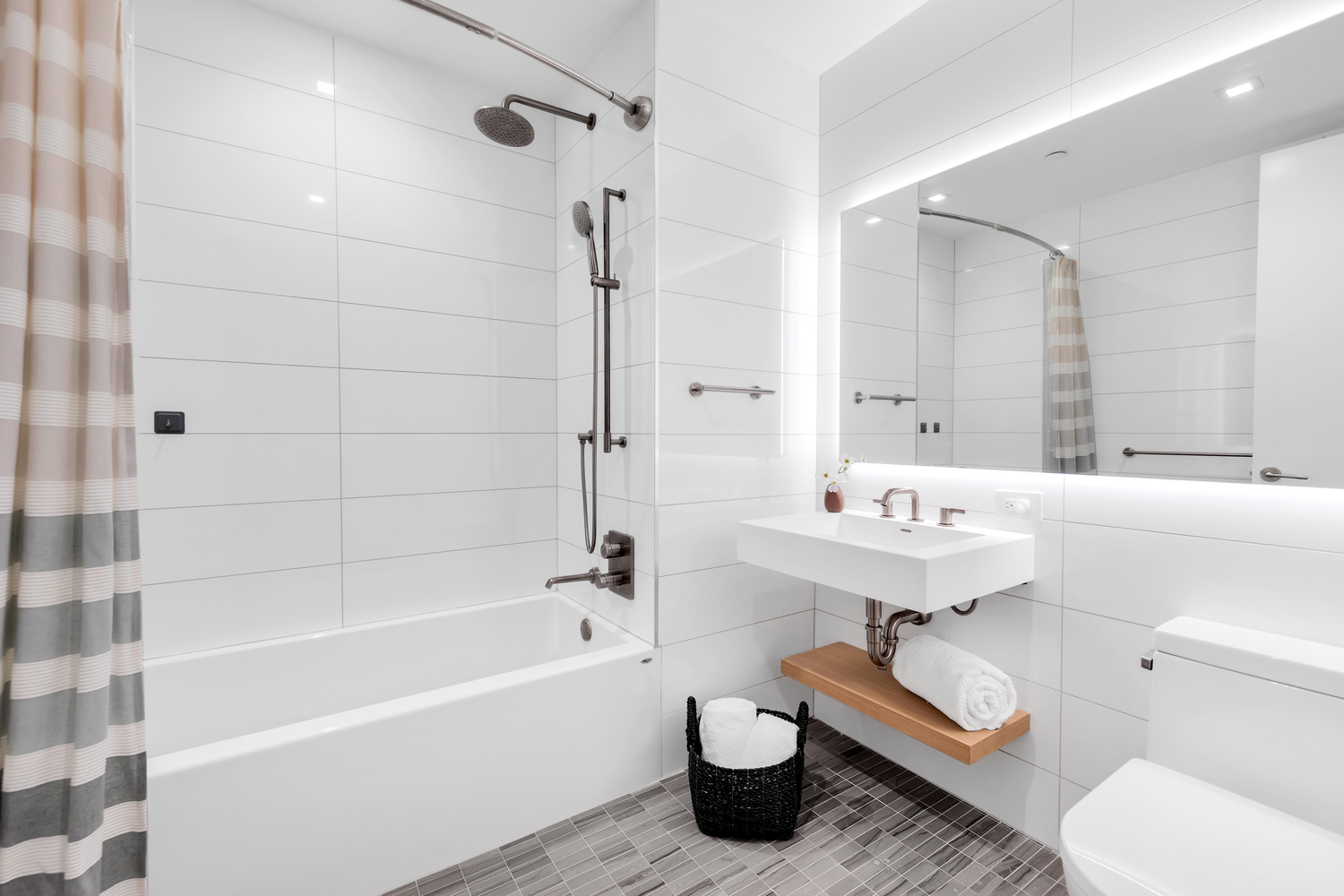 98 Front Street, Unit 8J Brooklyn, NY 11201 - Photo 9 of 18 a bathroom with a sink toilet and shower