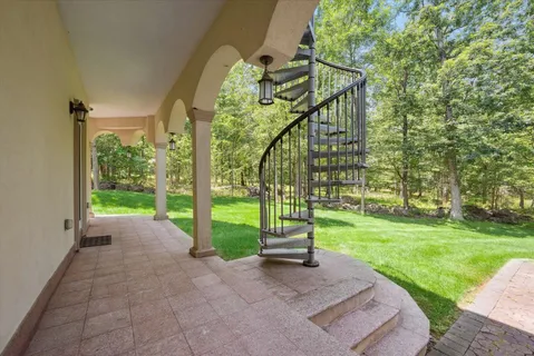 a kitchen with stainless steel appliances kitchen island granite countertop a sink and a refrigerator