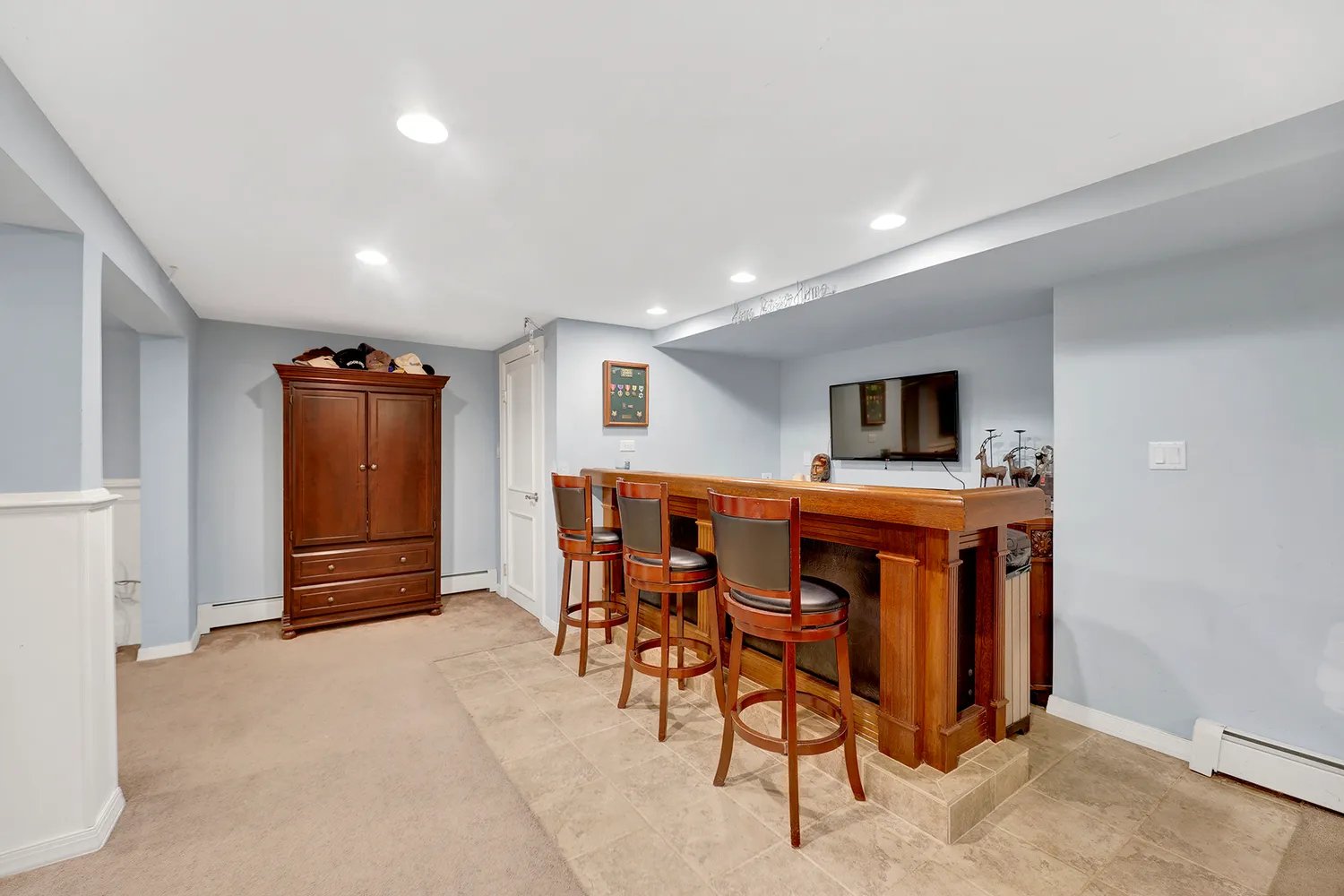 an aerial view of a house with a garden and swimming pool
