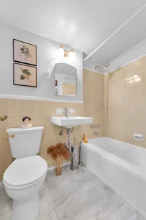 a bathroom with a sink a toilet and a bathtub