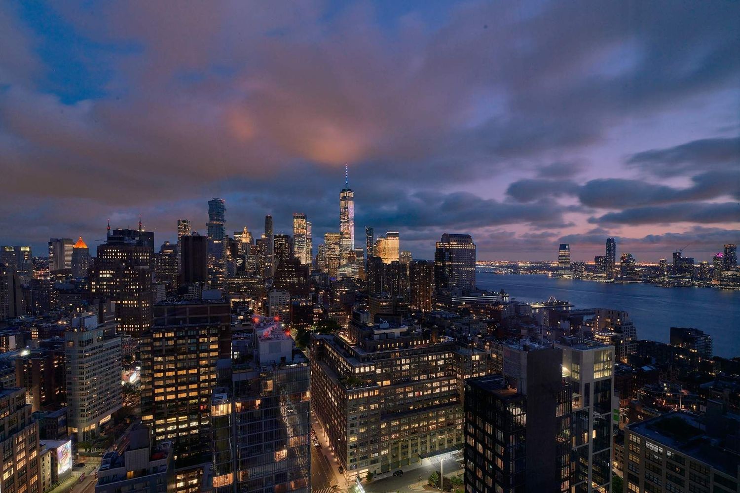 246 Spring Street, Unit 4111 Manhattan, NY 10013 - Photo 9 of 19 a view of a city with tall buildings