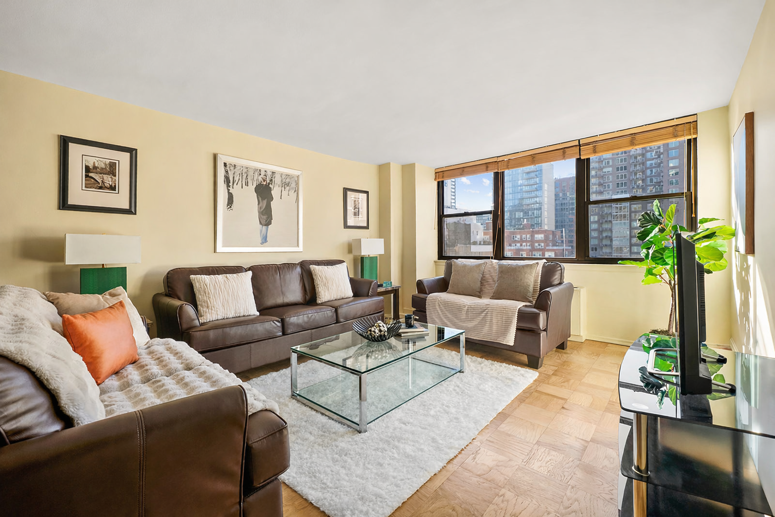 225 East 36th Street, Unit 10N Manhattan, NY 10016 - Photo 1 of 13 a living room with furniture and a large window