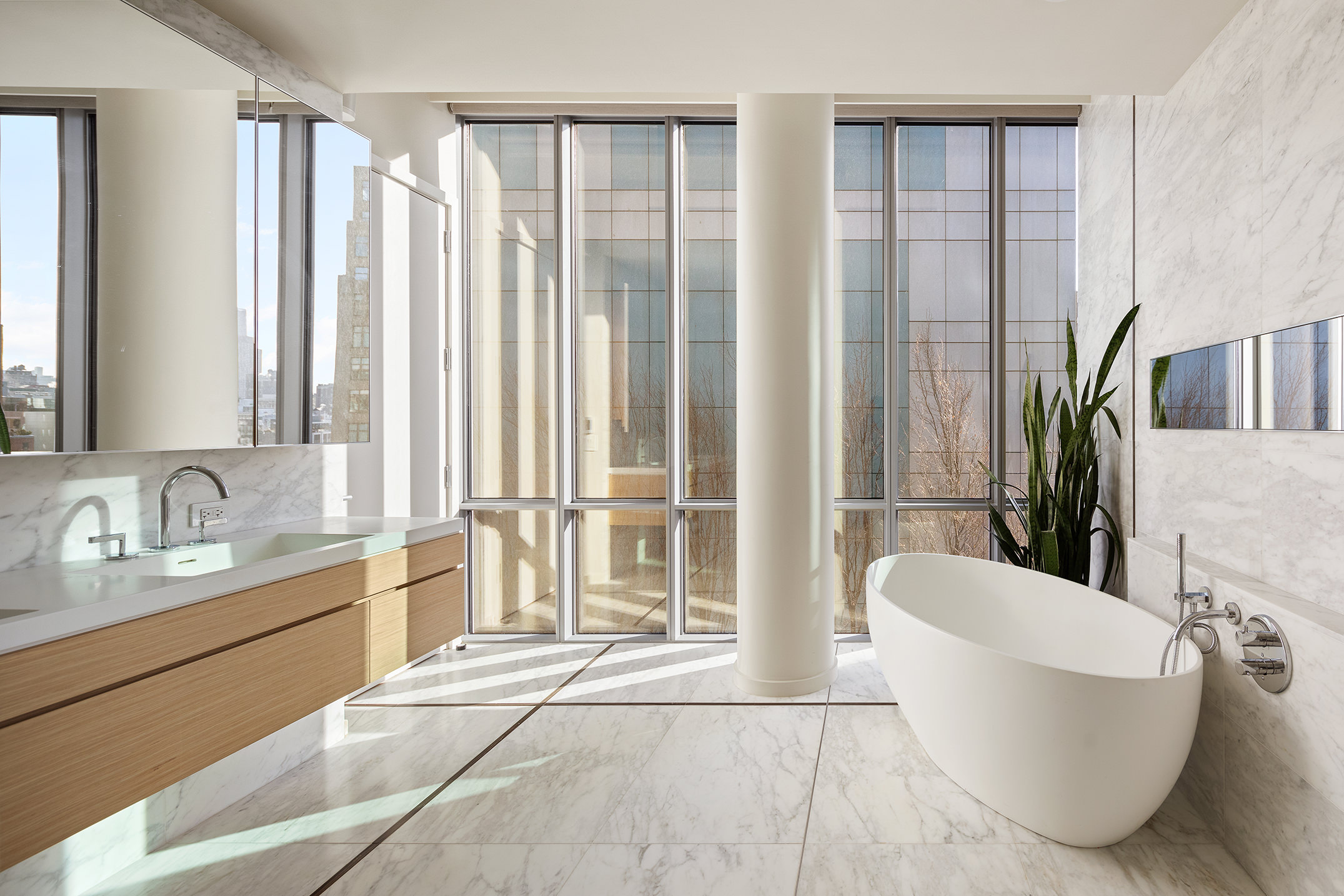 565 Broome Street, Unit S11E Manhattan, NY 10013 - Photo 8 of 11 a spacious bathroom with a bathtub and sink