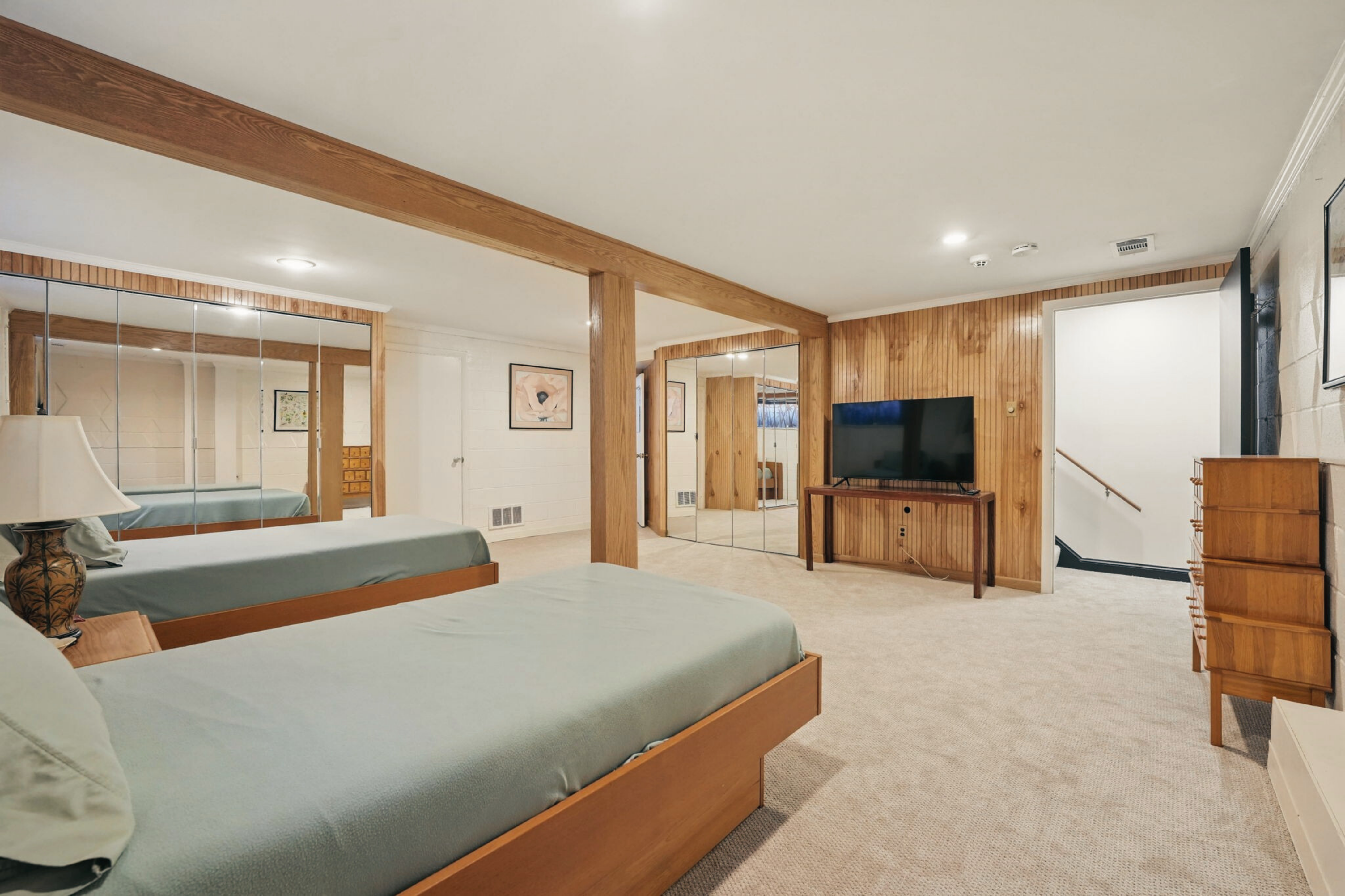 8003 16th Street Northwest Washington, DC 20012 - Photo 35 of 38 a spacious bedroom with a bed and a flat screen television