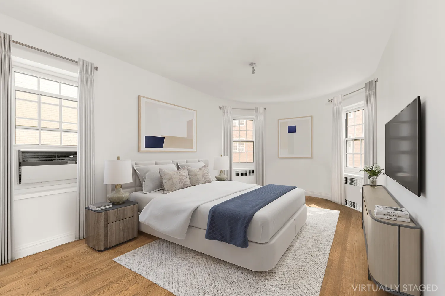 a bedroom with a large bed and a flat screen tv