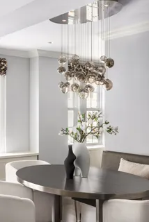 a table with a vase and flowers on it