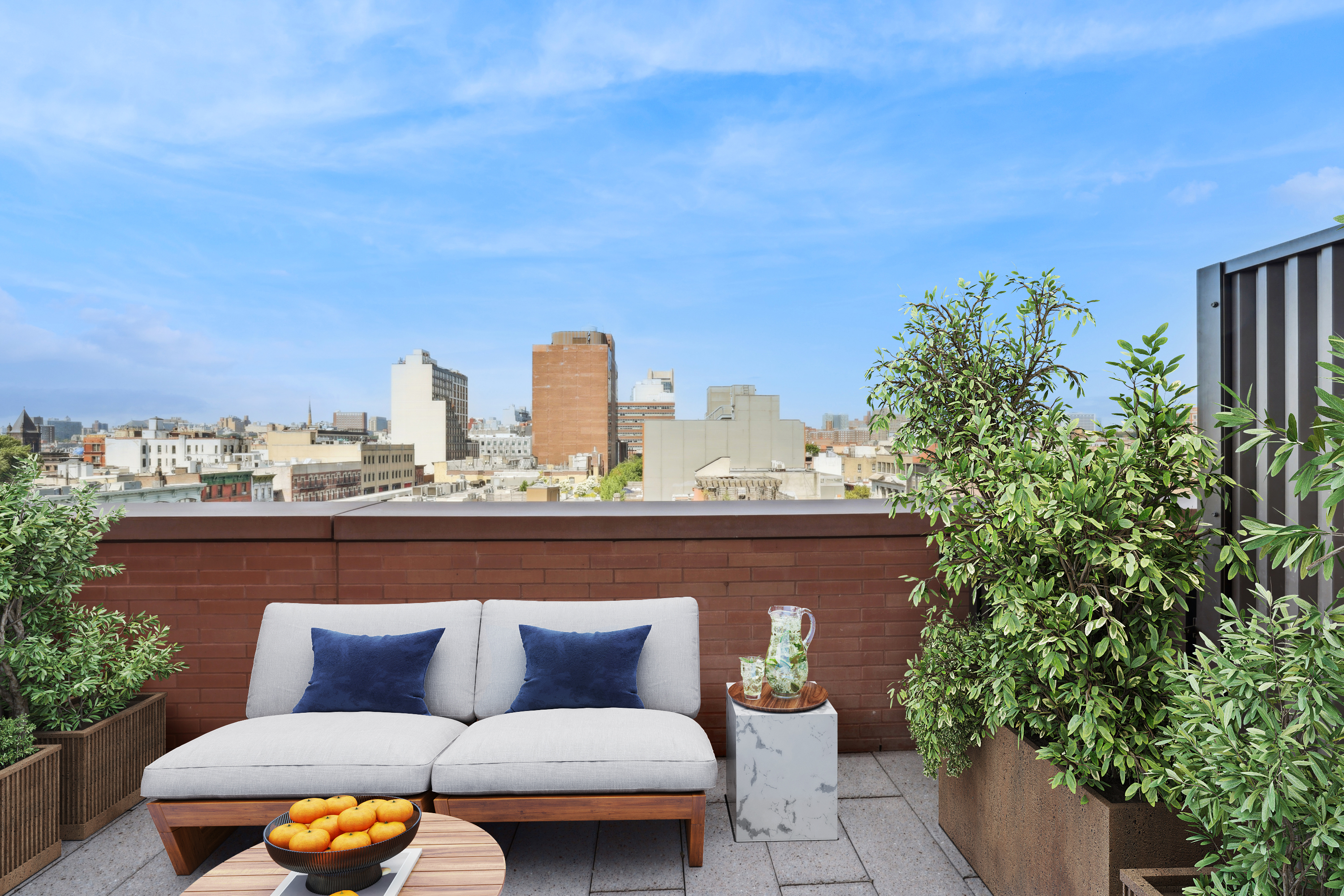 a outdoor sitting area with a couch and trees