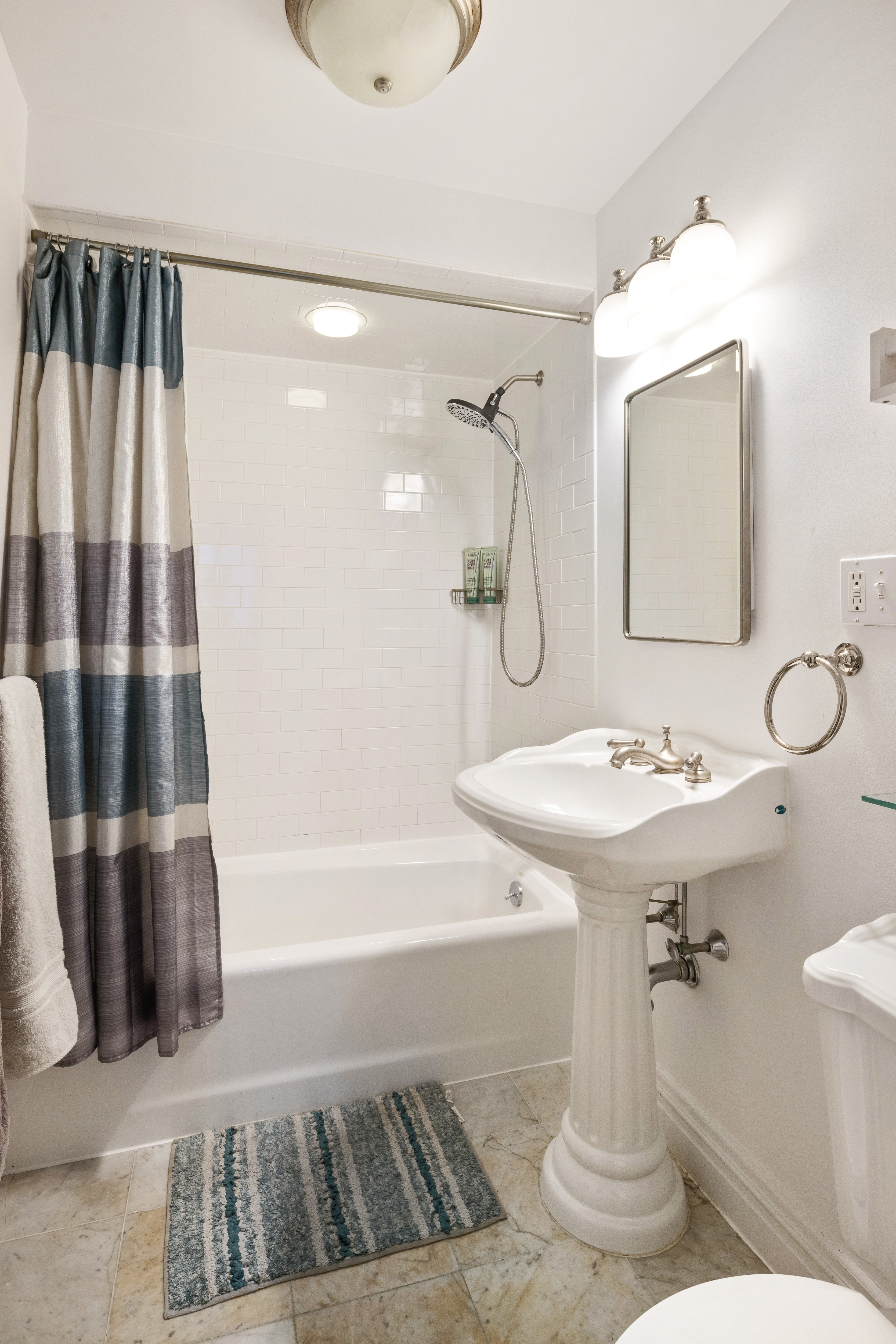 303 Warren Street, Unit 2 Brooklyn, NY 11201 - Photo 6 of 10 a bathroom with a sink a toilet and shower