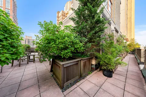 a view of a backyard with sitting area