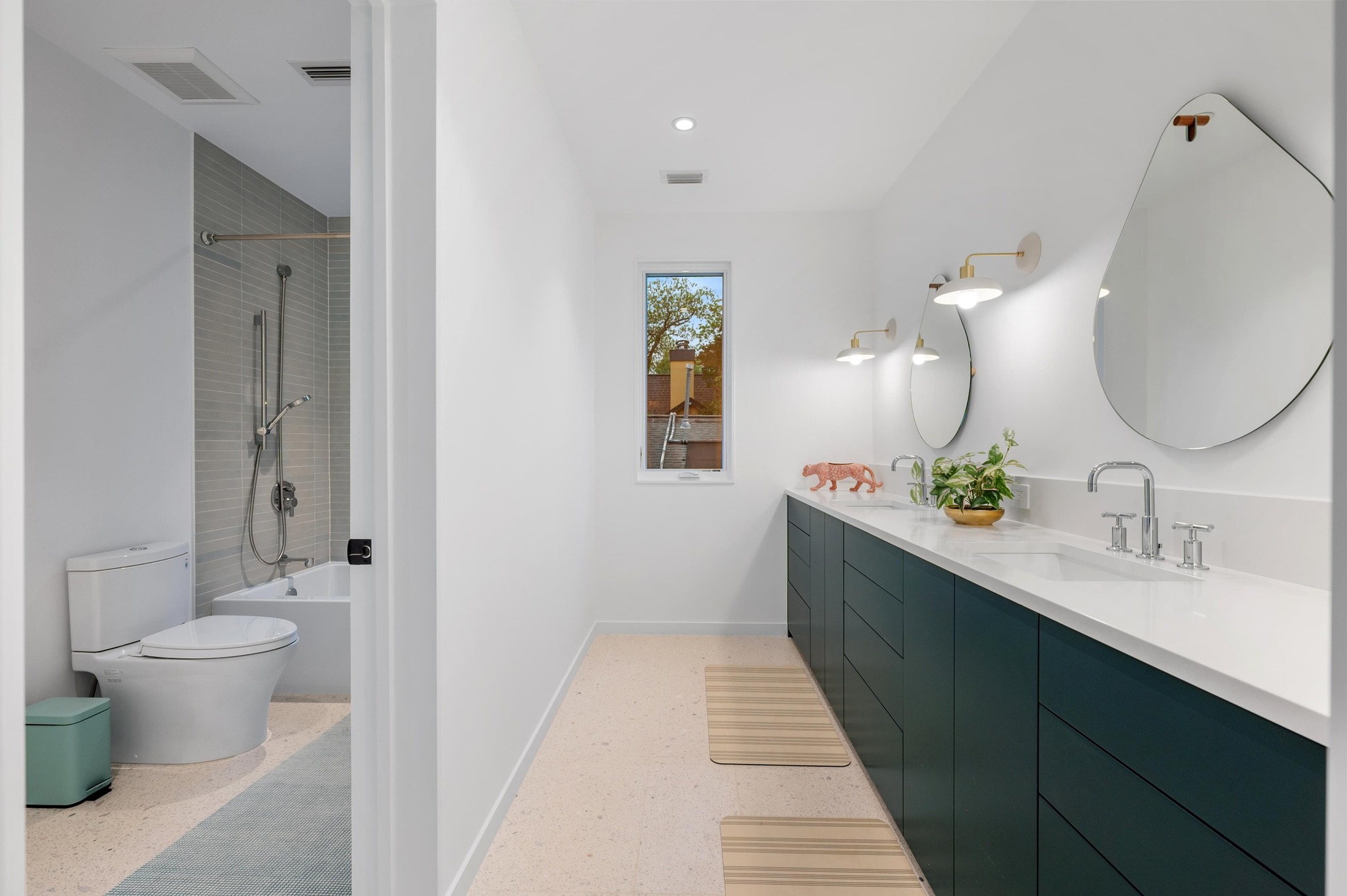 1206 Bickler Road Austin, TX 78704 - Photo 51 of 65 a spacious bathroom with a toilet sink and mirror