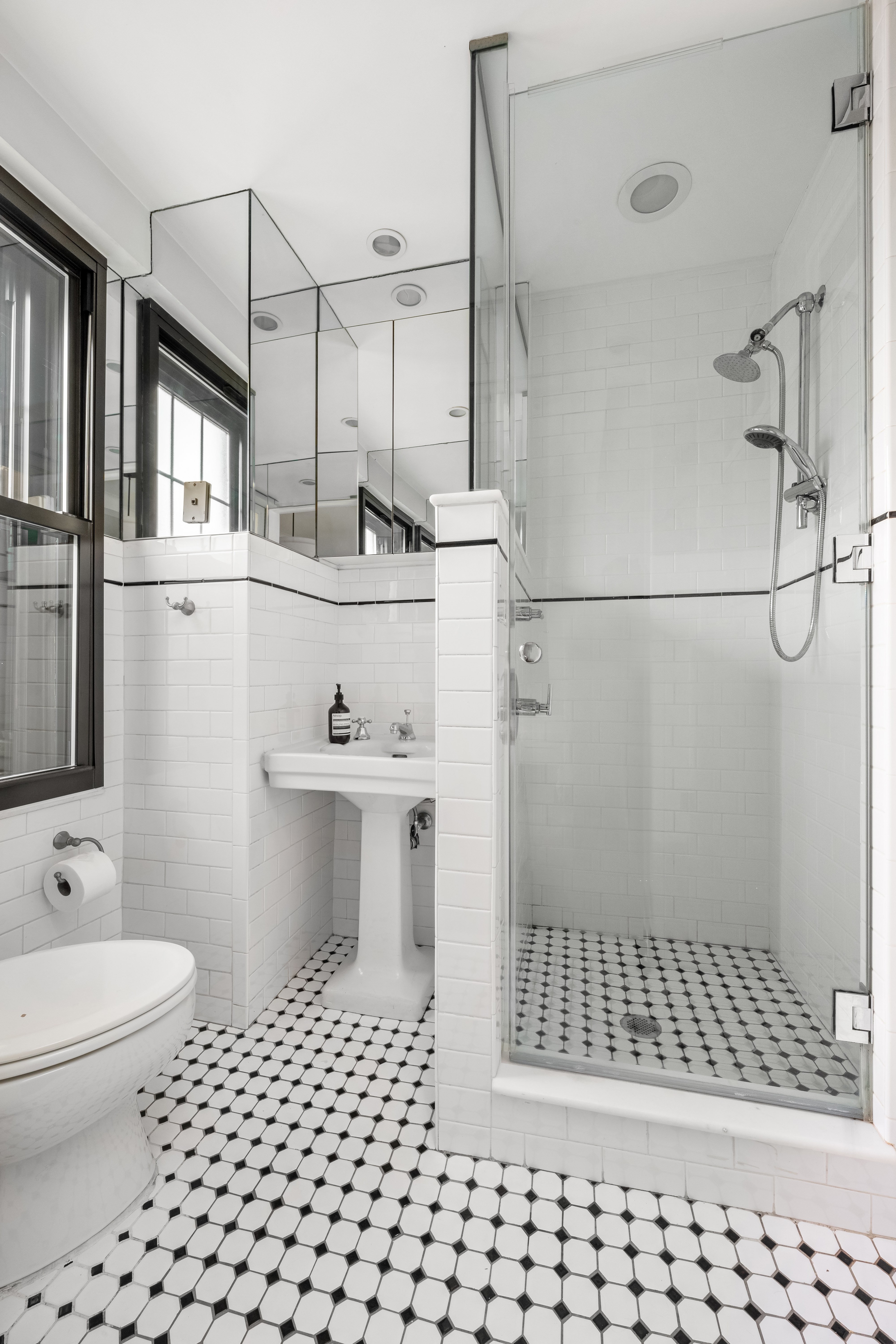170 2nd Avenue, Unit 4A Manhattan, NY 10003 - Photo 5 of 11 a bathroom with a sink a toilet and shower
