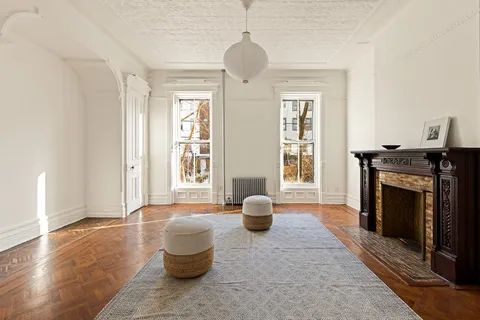 a living room with furniture and a fireplace