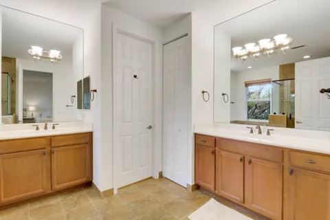 a bathroom with a sink vanity and mirror