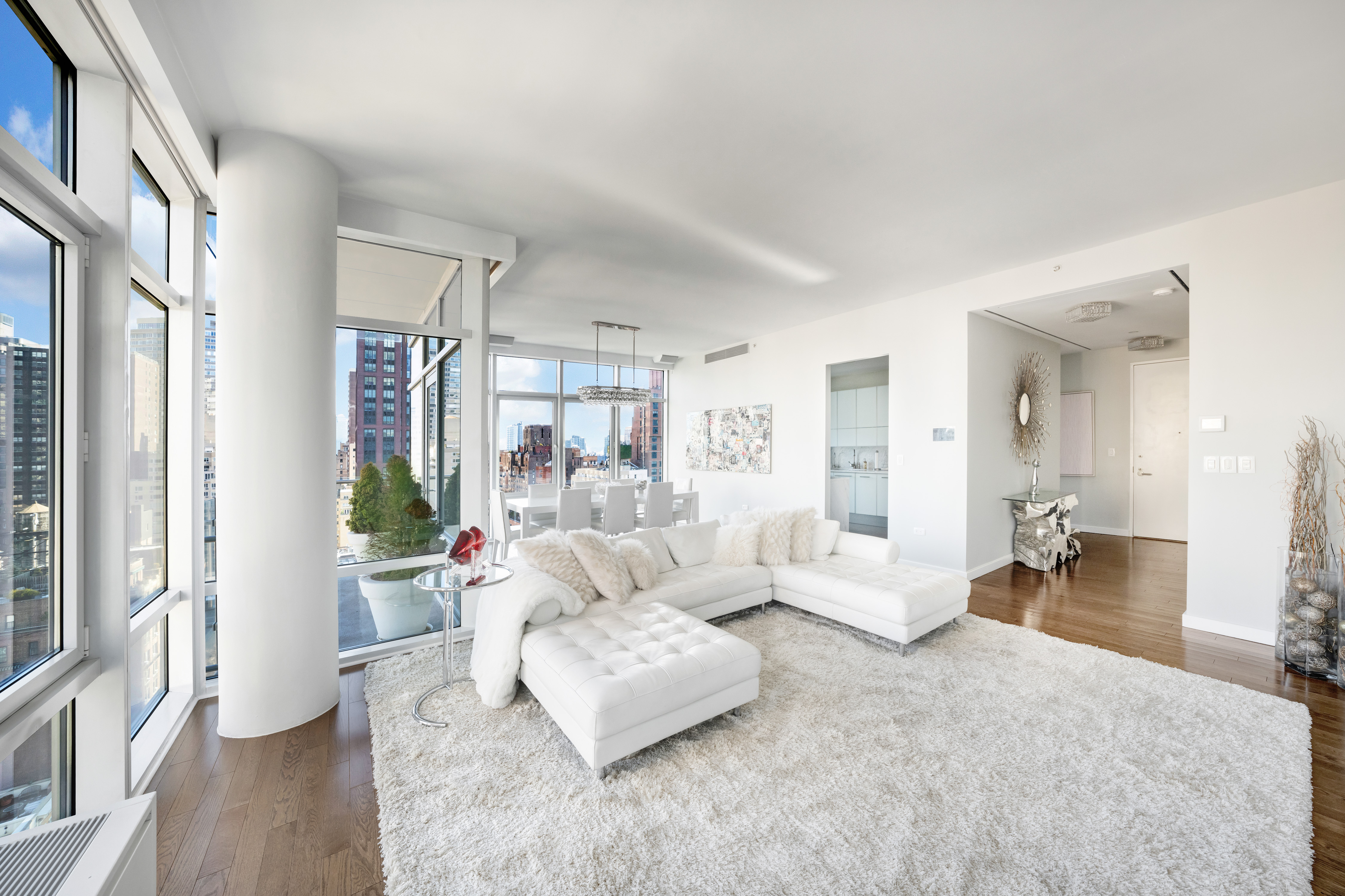 310 East 53rd Street, Unit 18A Manhattan, NY 10022 - Photo 4 of 19 a living room with furniture and a large window