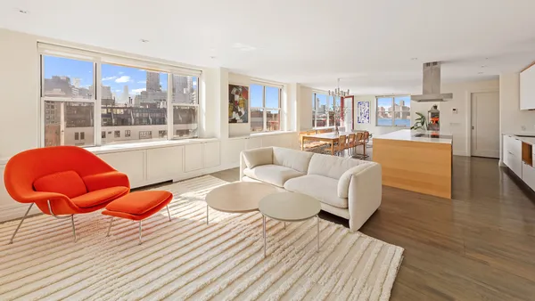 a living room with furniture and window