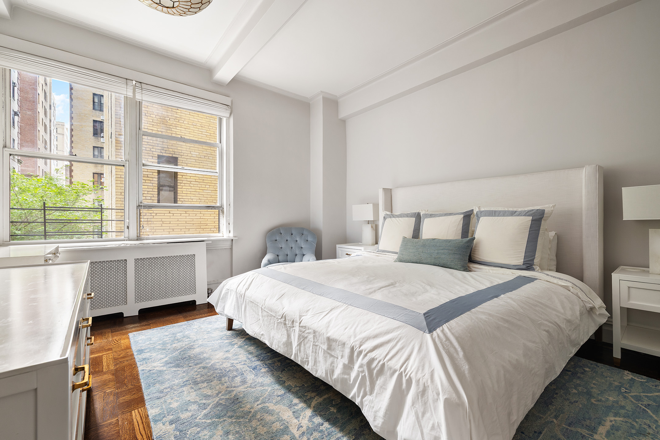 201 West 89th Street, Unit 2F Manhattan, NY 10024 - Photo 4 of 20 a bedroom with a bed and a window