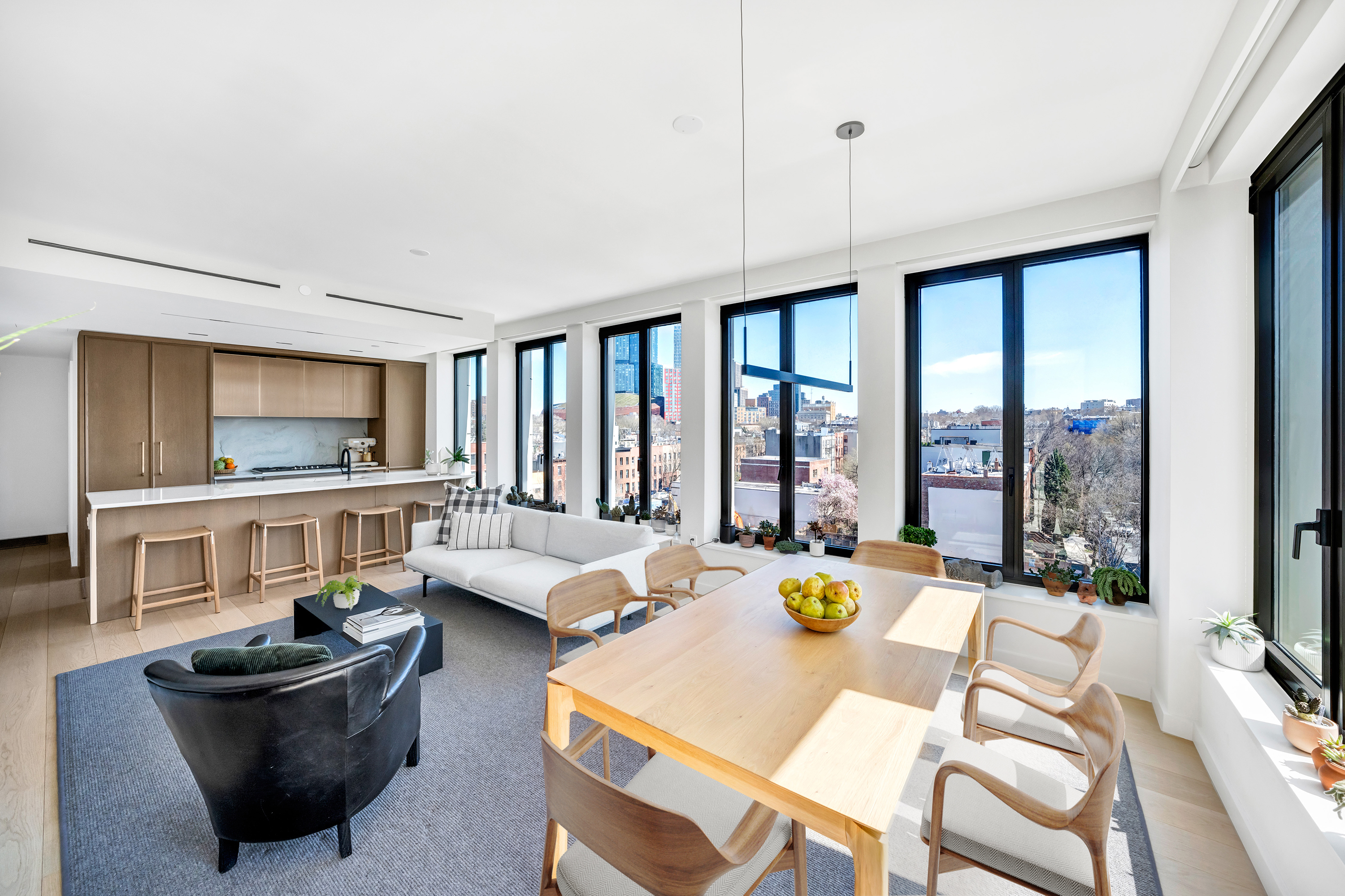 58 St Marks Place, Unit 608 Brooklyn, NY 11217 - Photo 3 of 22 a living room with furniture and a large window