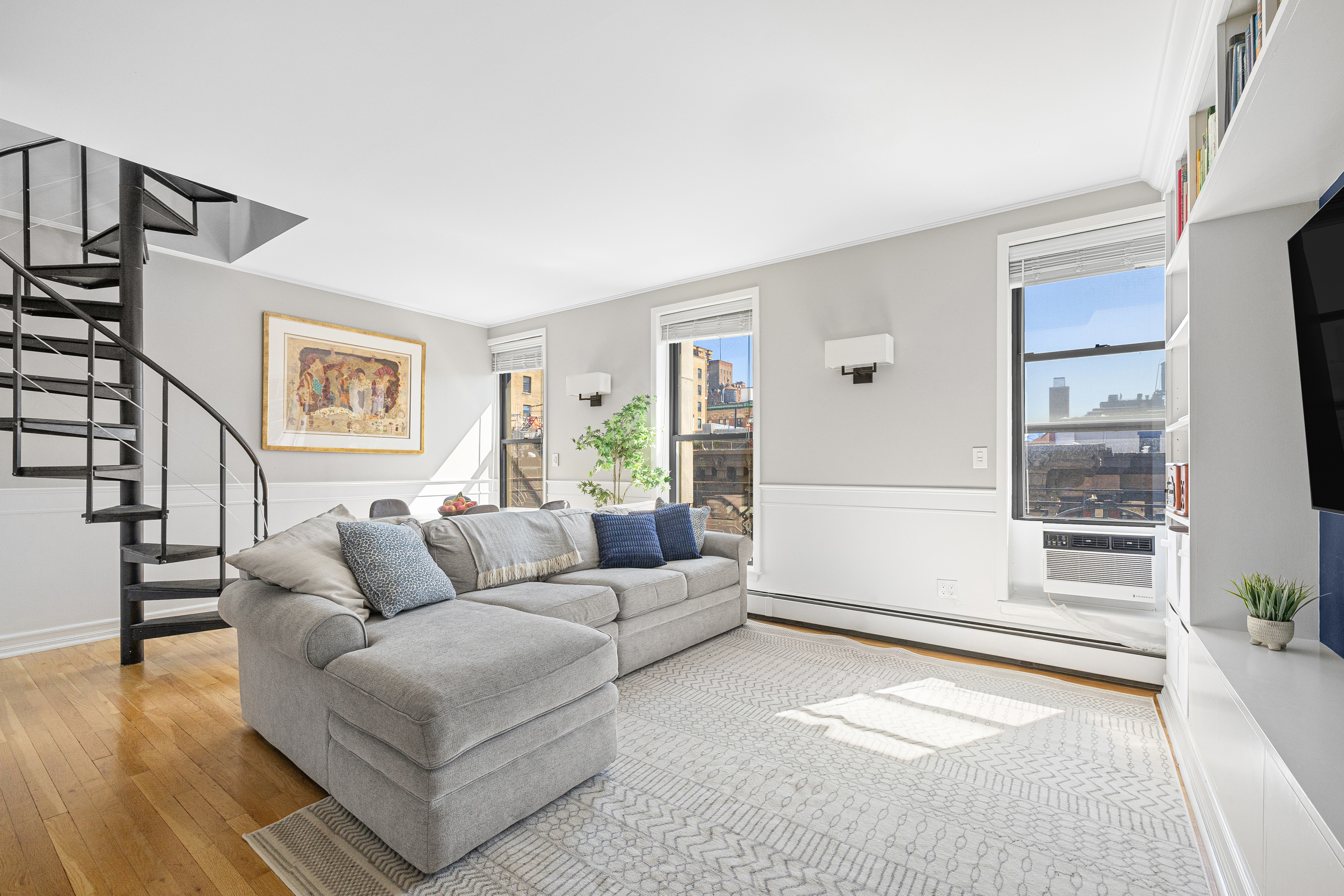 315 West 99th Street, Unit PHA Manhattan, NY 10025 - Photo 3 of 17 a living room with furniture and a window with outer view