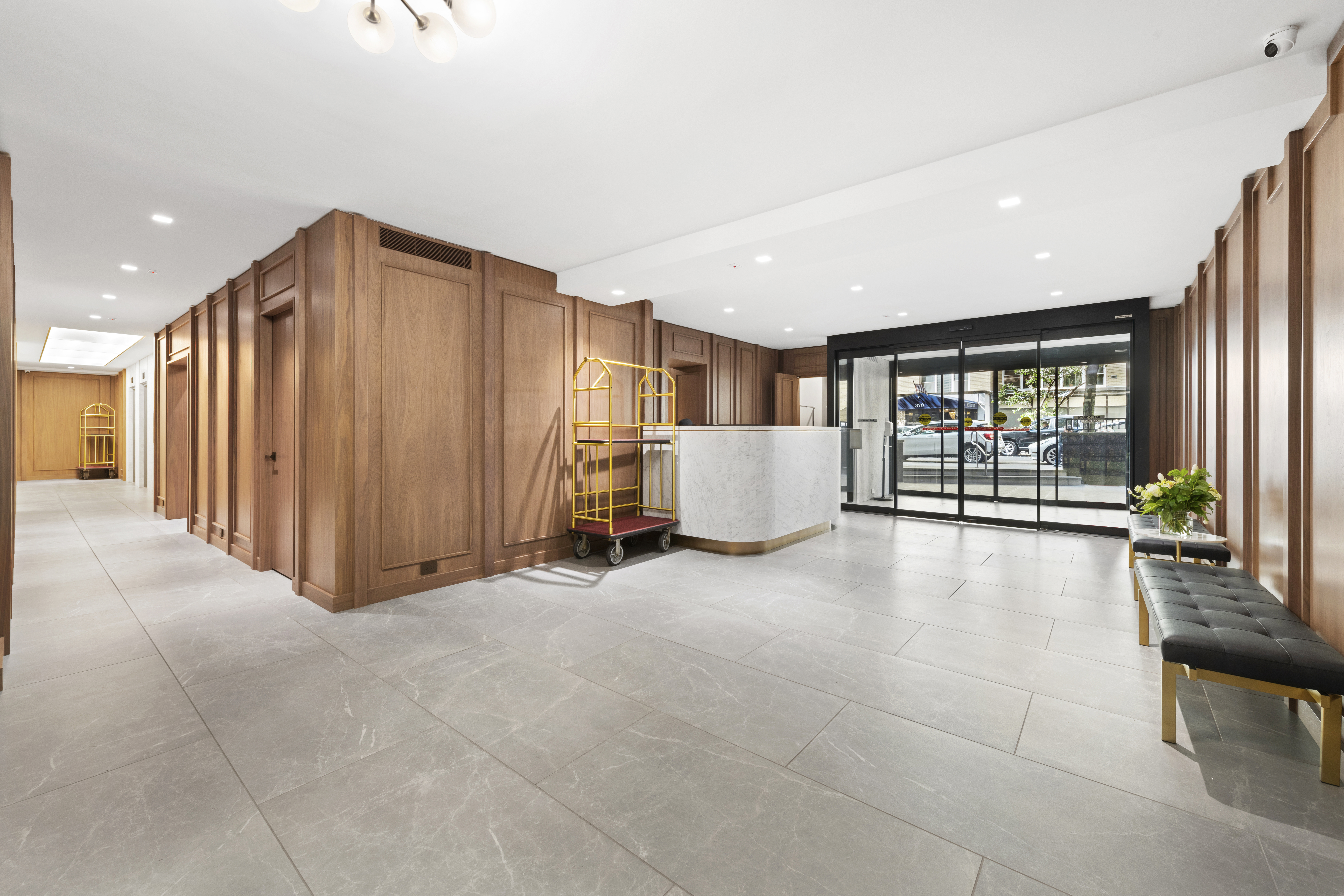 363 East 76th Street, Unit 11K Manhattan, NY 10021 - Photo 11 of 16 a view of an empty room with floor to ceiling window and kitchen view