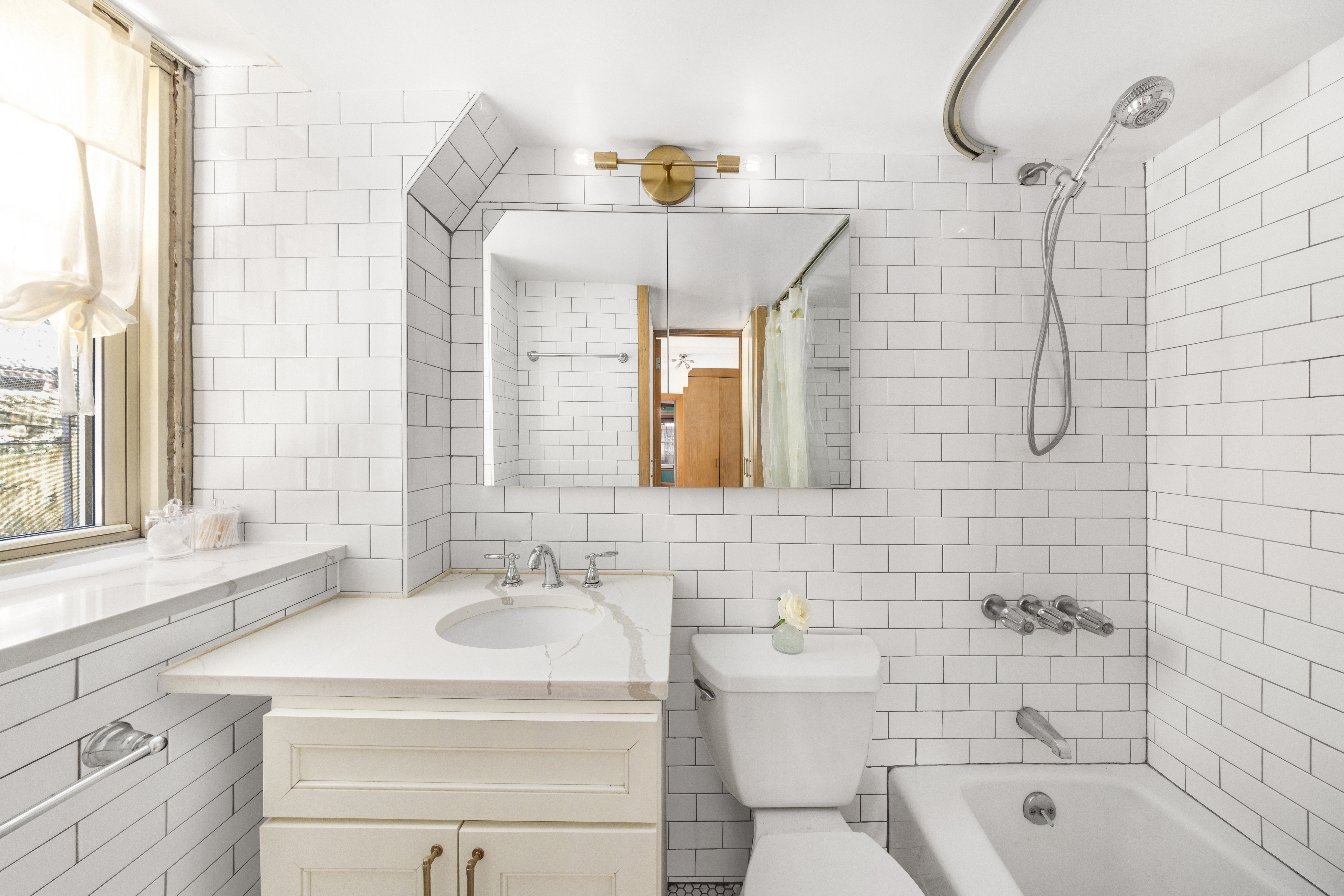 71 Barrow Street, Unit 19 Manhattan, NY 10014 - Photo 7 of 9 a bathroom with a sink a toilet and shower