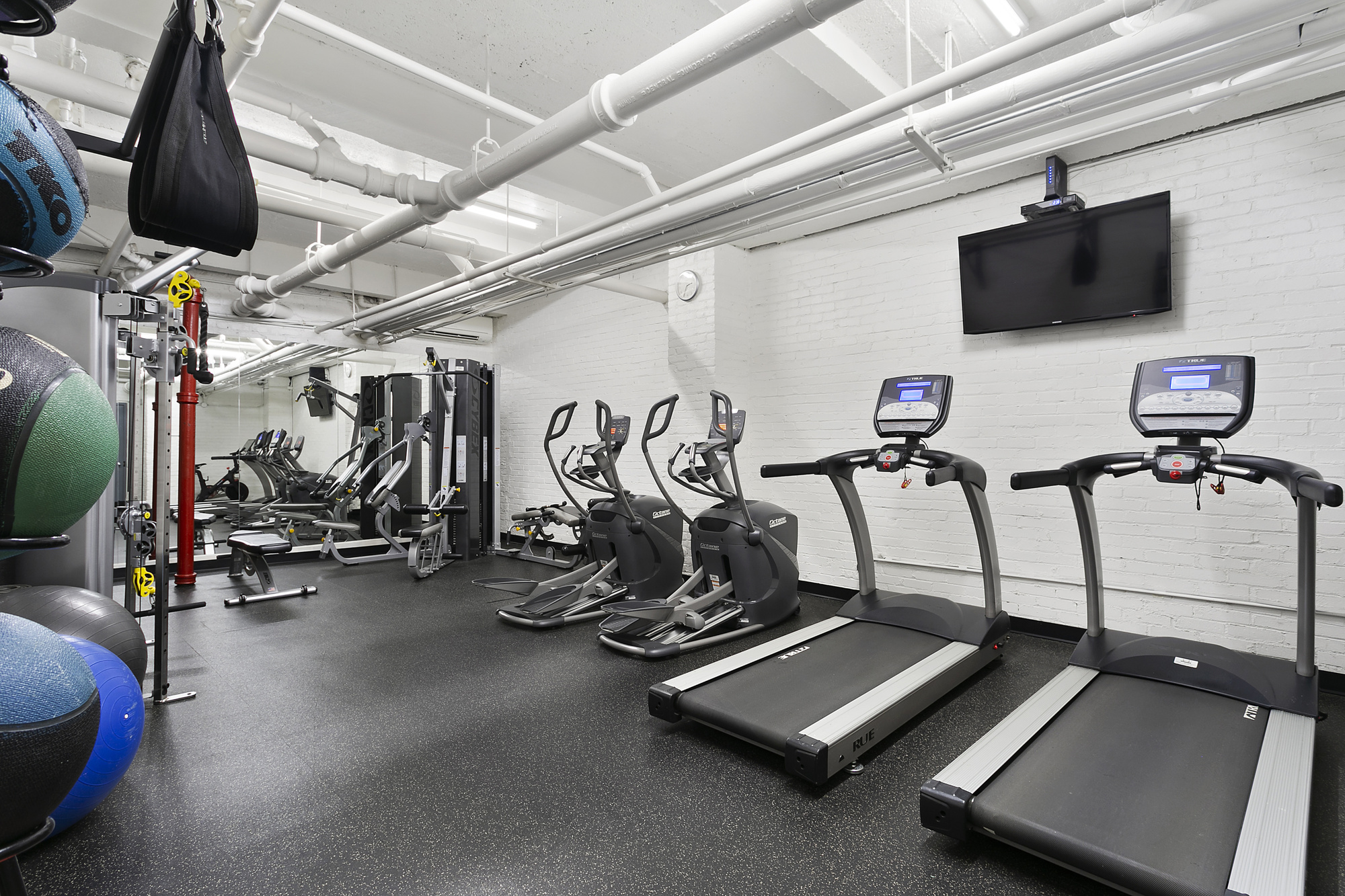 200 East 16th Street, Unit 5LM Manhattan, NY 10003 - Photo 12 of 16 a view of a room with gym equipment