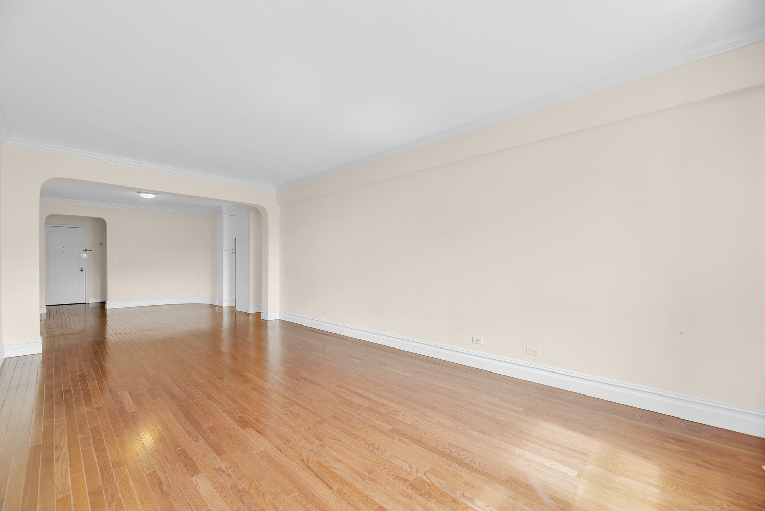 73-12 35th Avenue, Unit A62 Queens, NY 11372 - Photo 3 of 10 a view of an empty room and wooden floor