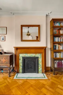 a view of living room with furniture and a fireplace