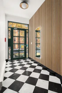 a view of a livingroom with a black and white checkered floor