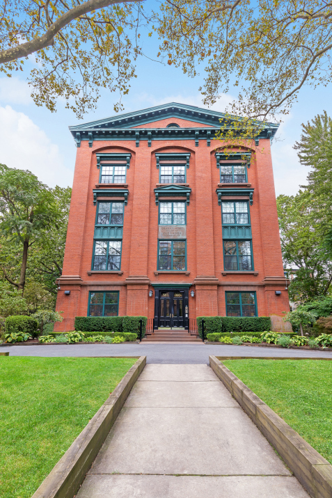 a front view of building with yard