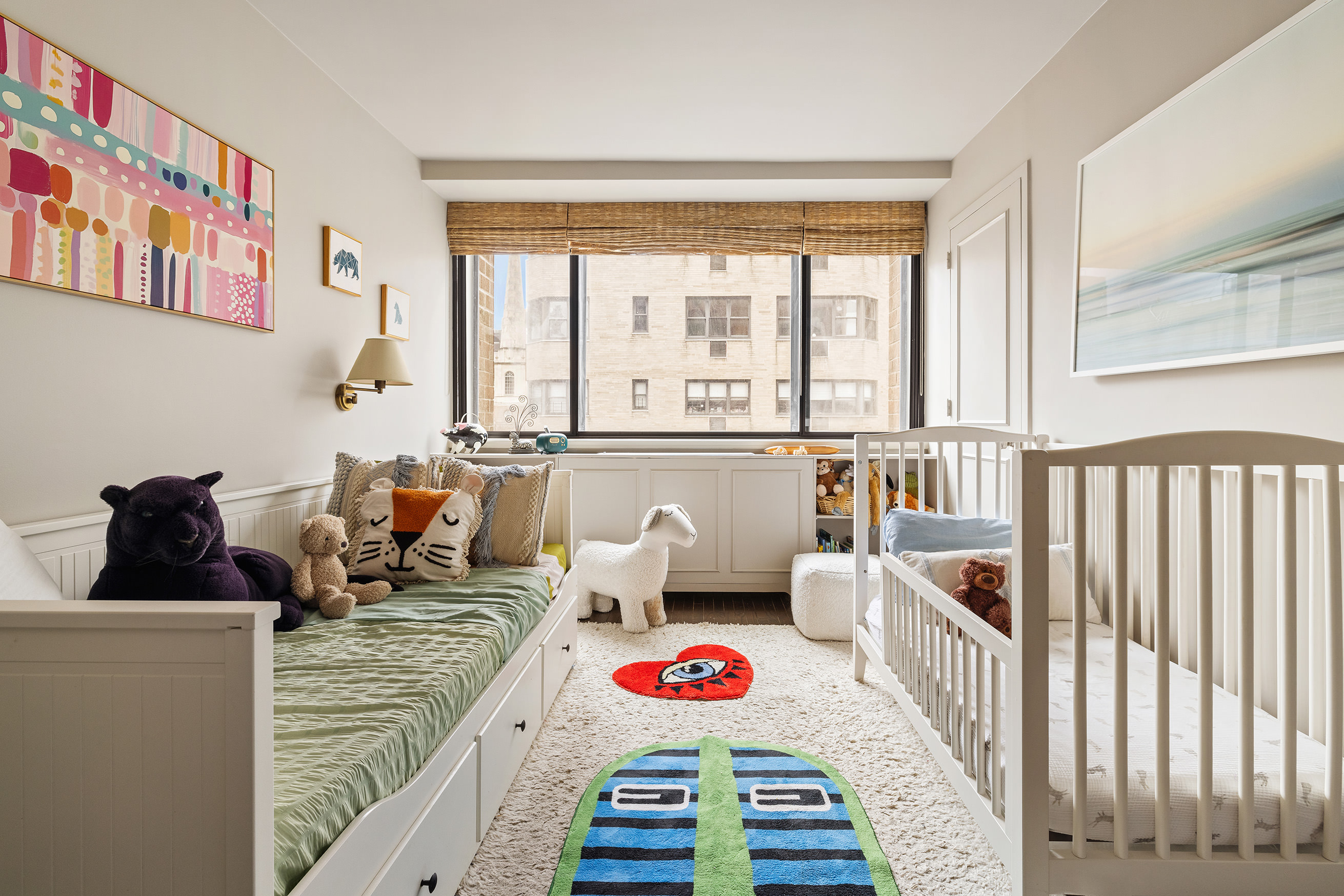 131 East 81st Street, Unit 9 Manhattan, NY 10028 - Photo 6 of 10 a living room with furniture and a floor to ceiling window