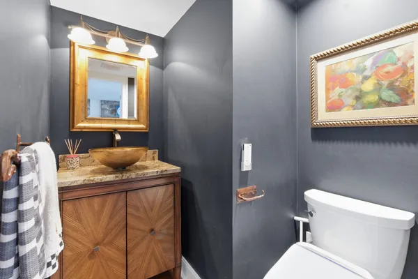 a kitchen with a refrigerator and a sink