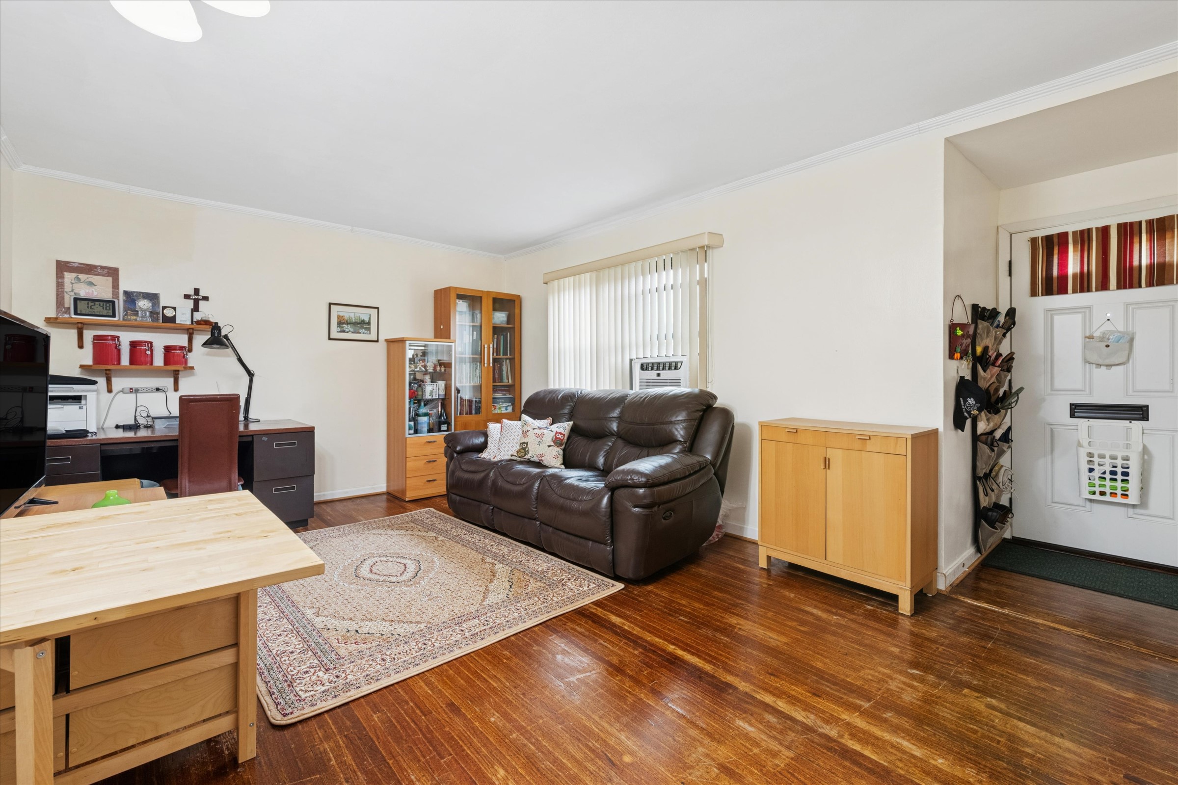 74-22 220th Street Oakland Garden, NY 11364 - Photo 4 of 16 a living room with furniture and a wooden floor