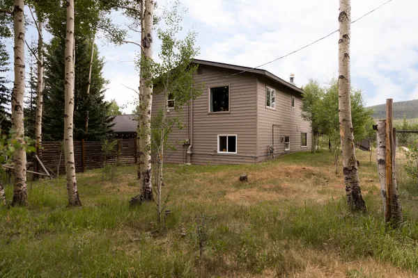 a view of a backyard of the house