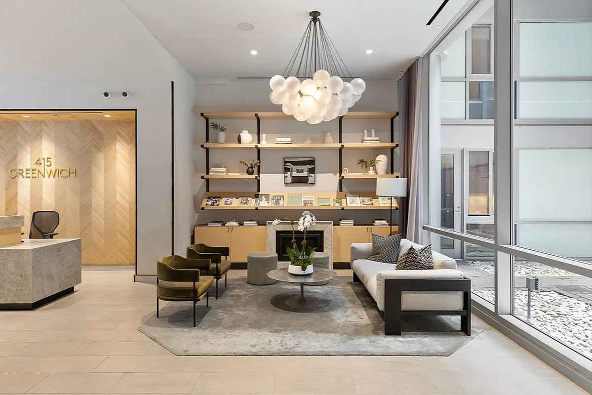 415 Greenwich Street, Unit 5D Manhattan, NY 10013 - Photo 13 of 16 a living room with fireplace furniture and a chandelier