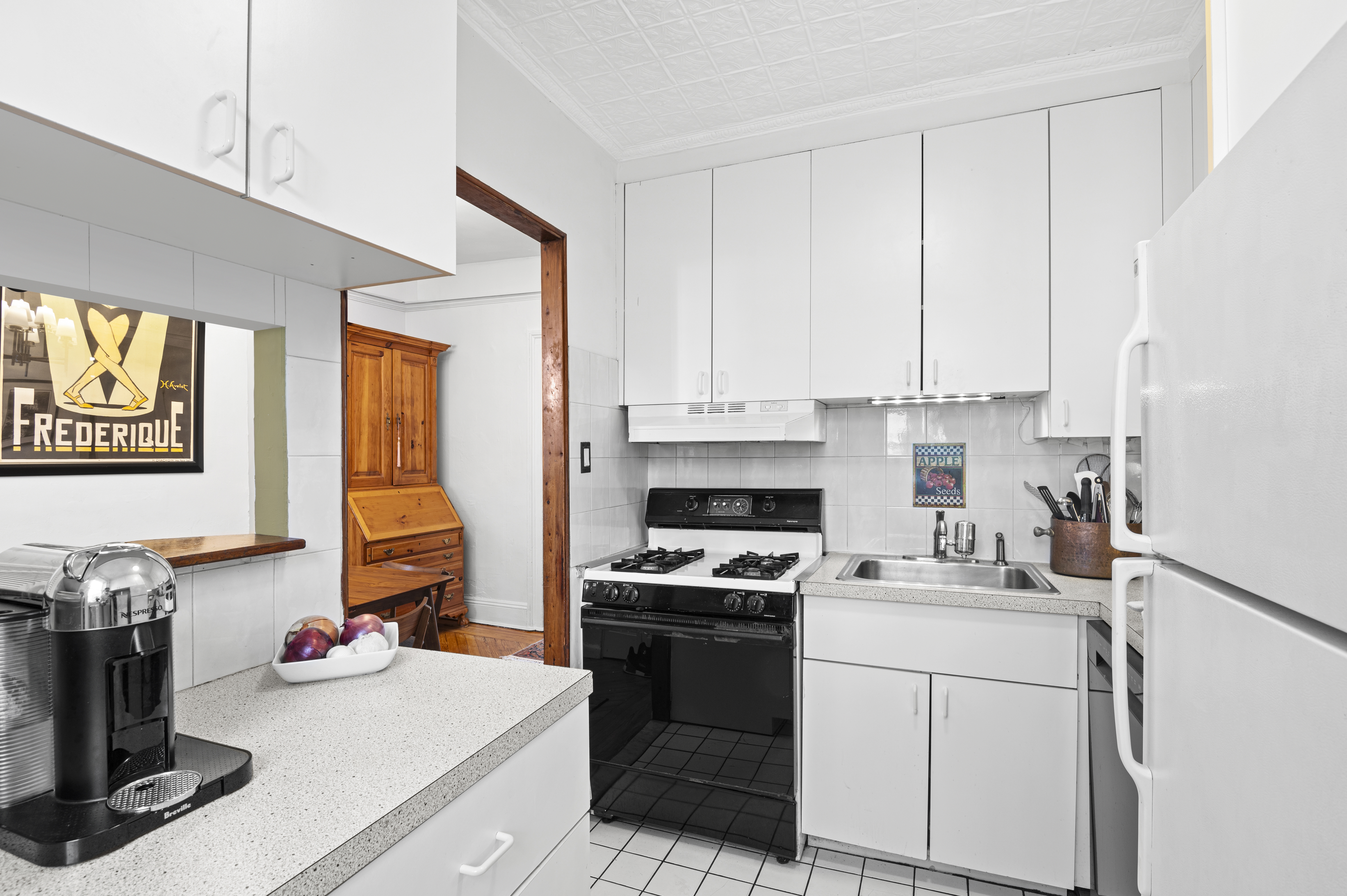 457 Warren Street Brooklyn, NY 11217 - Photo 7 of 16 a kitchen with a sink cabinets and appliances