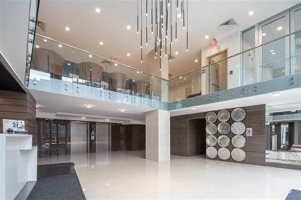 a large building with a large window and outdoor kitchen