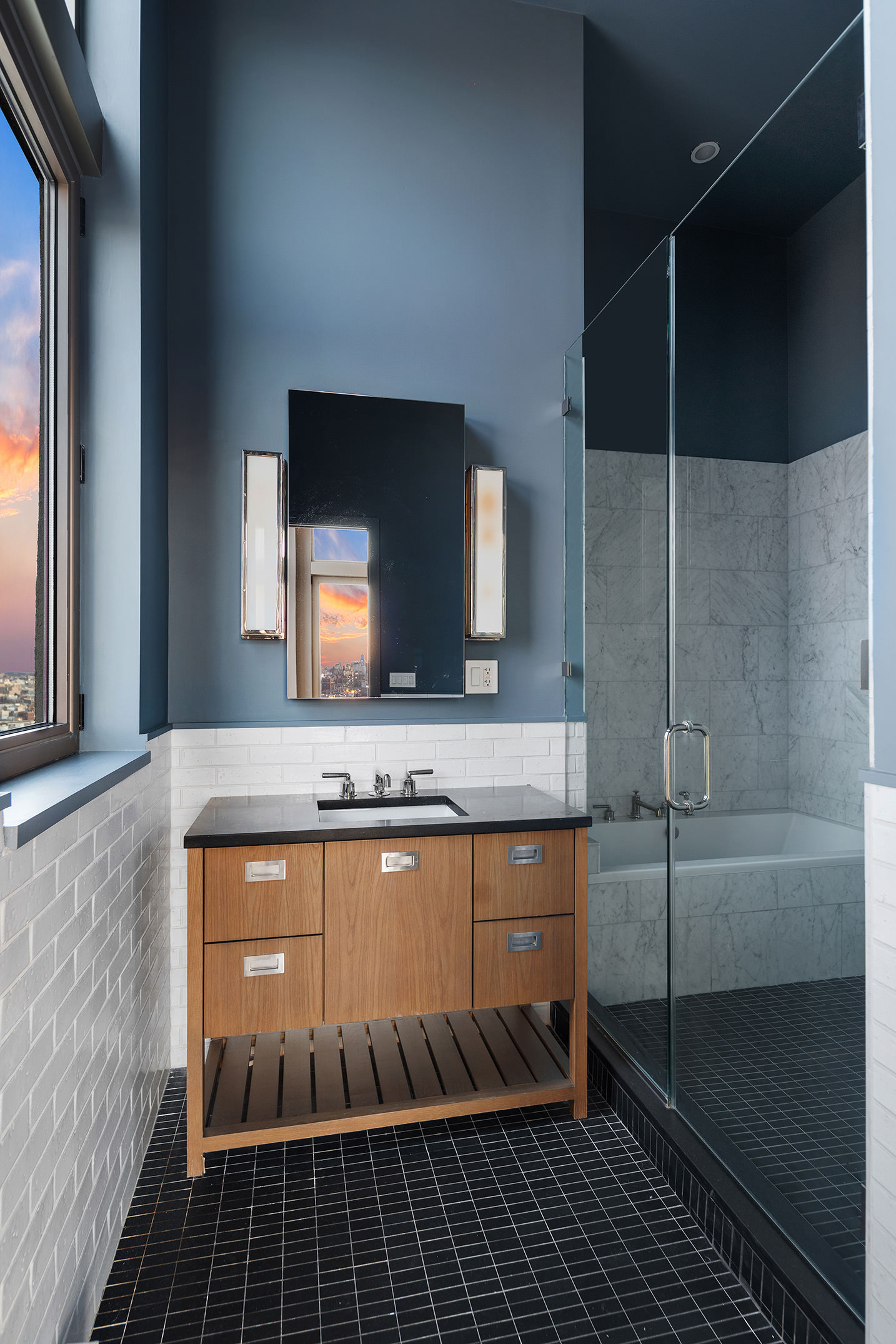 144 North 8th Street, Unit PH2 Brooklyn, NY 11249 - Photo 8 of 20 a bathroom with a sink a mirror and a shower