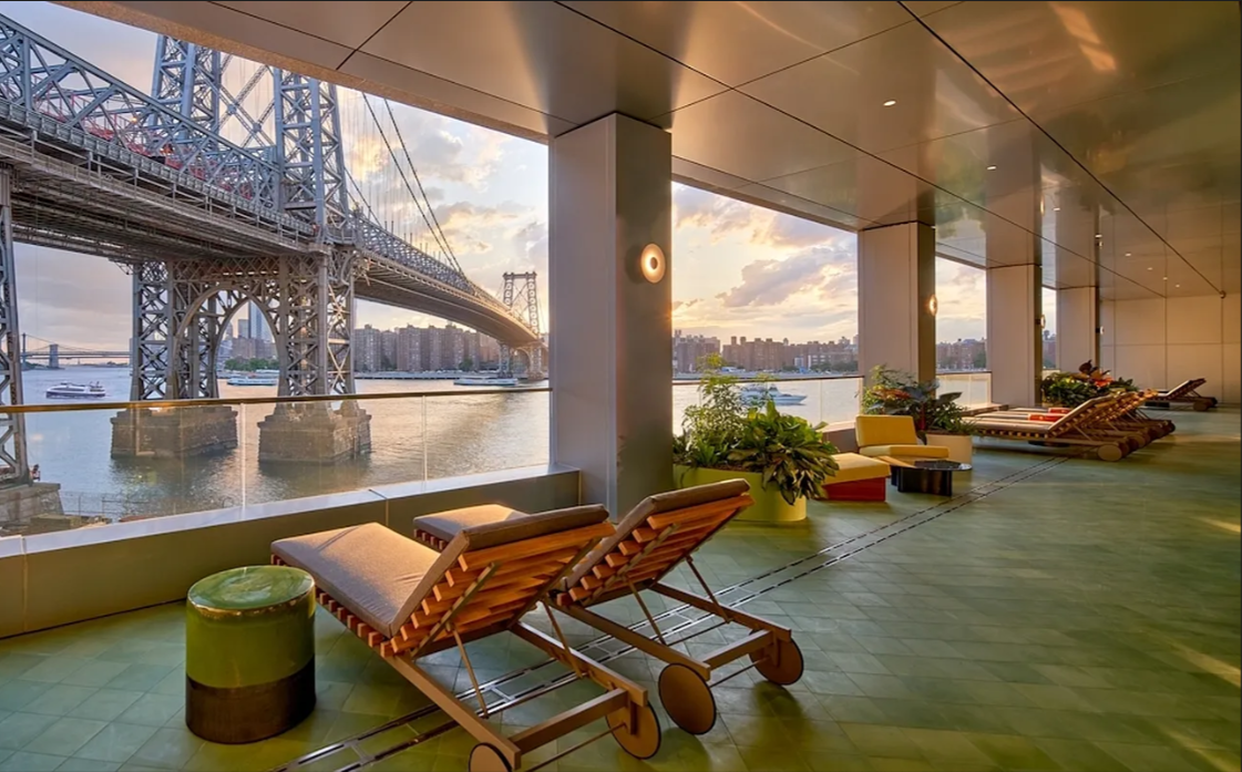 5 South 5th Street, Unit 5300 Brooklyn, NY 11249 - Photo 18 of 28 a living room with patio furniture and a floor to ceiling window