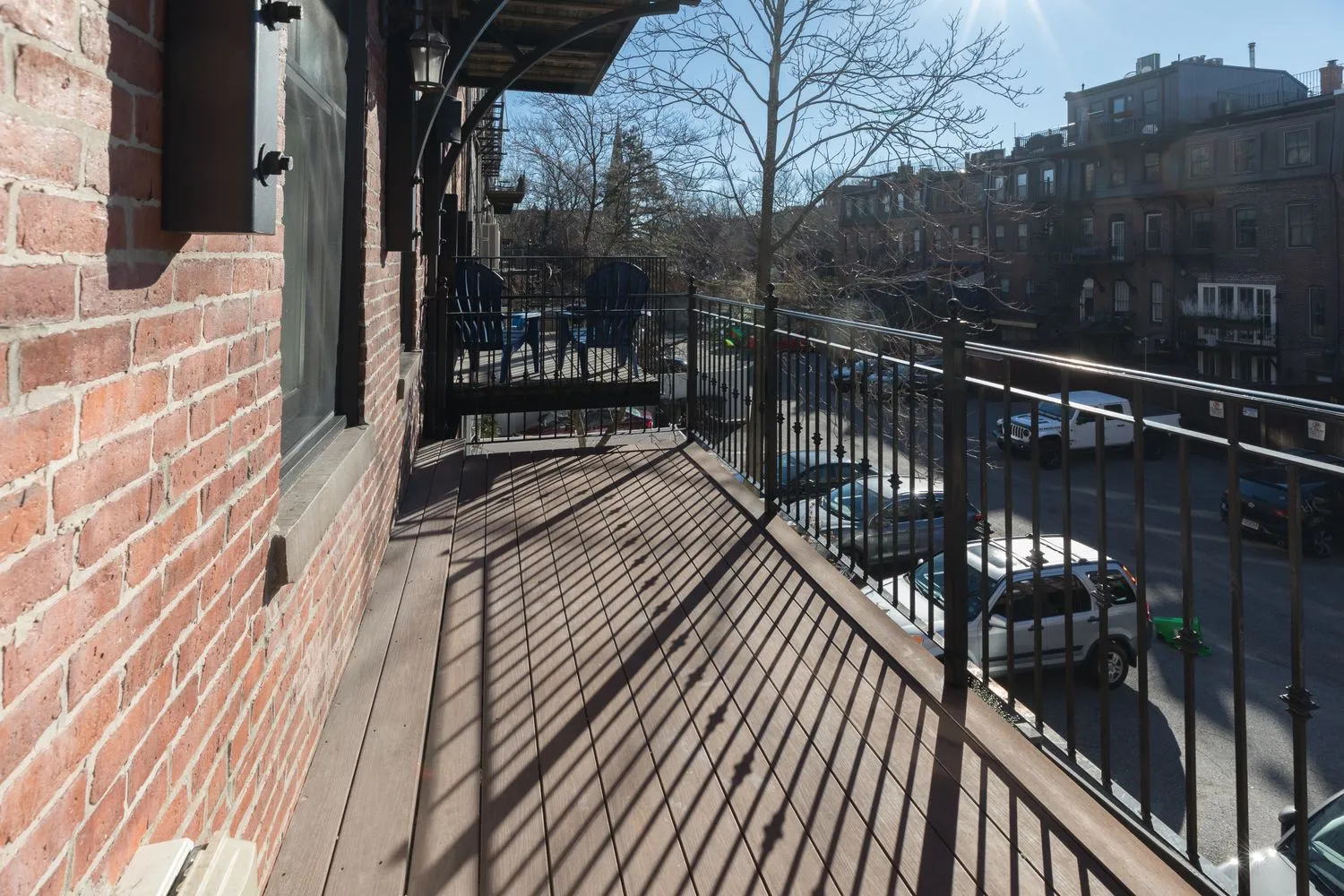 a view of balcony with wooden floor