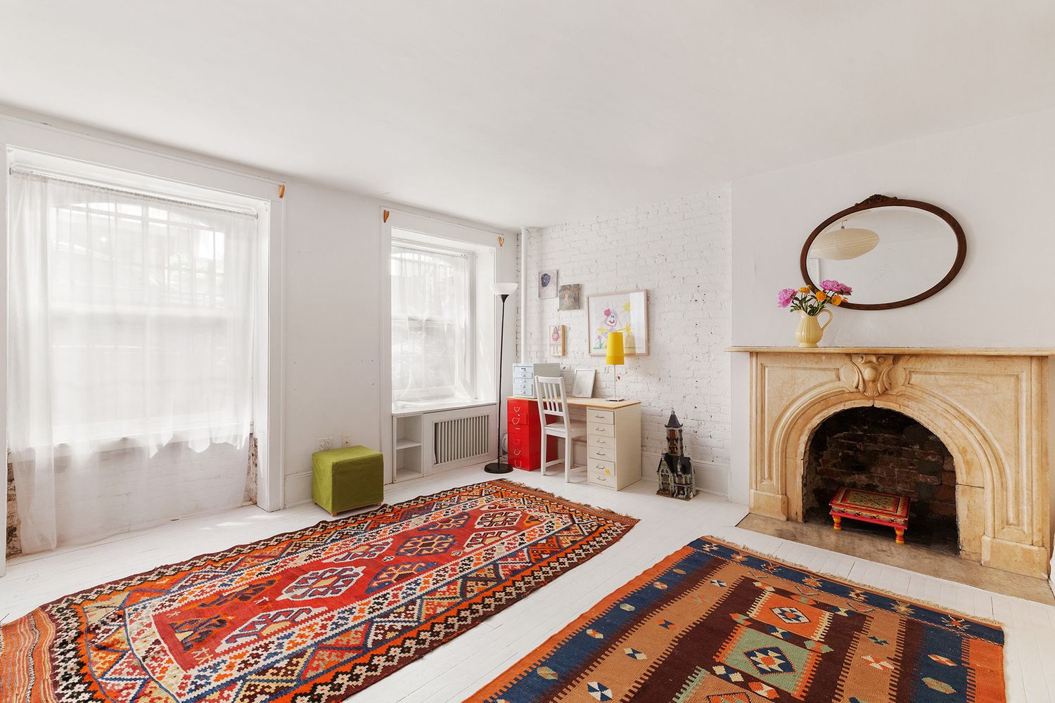 a bedroom with a bed and a fireplace